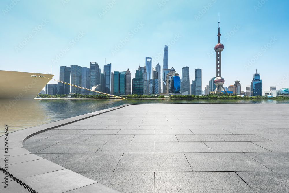 Panoramic skyline and modern commercial office buildings with empty floor in Shanghai, China.