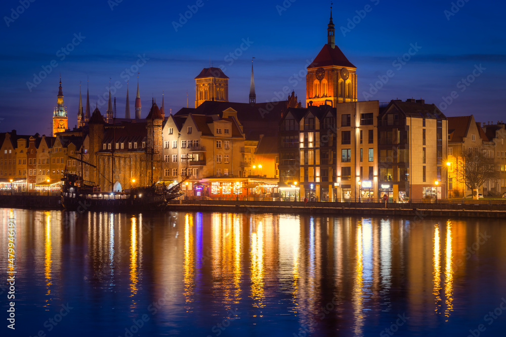 Amazing architecture of Gdansk old town by the Motlawa River at dusk. Poland