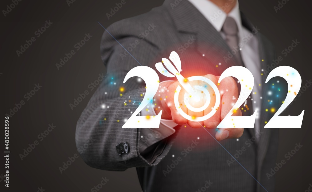 Business target and goal on New year 2022, hand holding 2022 virtual screen. new years business idea