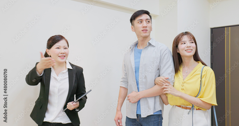 couple and real estate agent