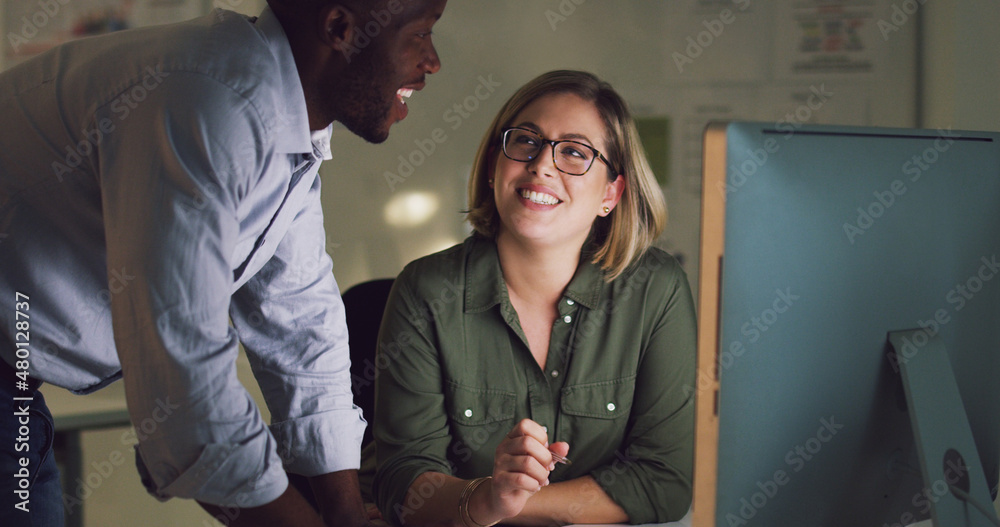 What do you think. Cropped shot of two businesspeople working together on a computer in their office