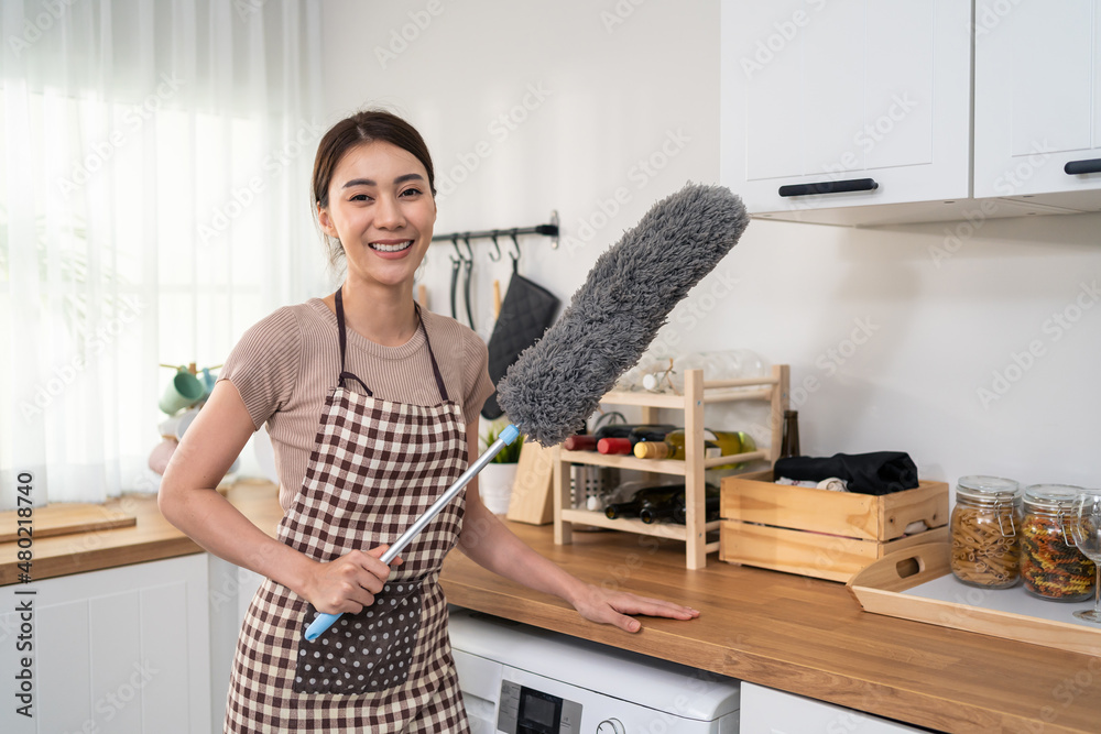 Portrait of Asian young cleaning service woman worker working in house. 