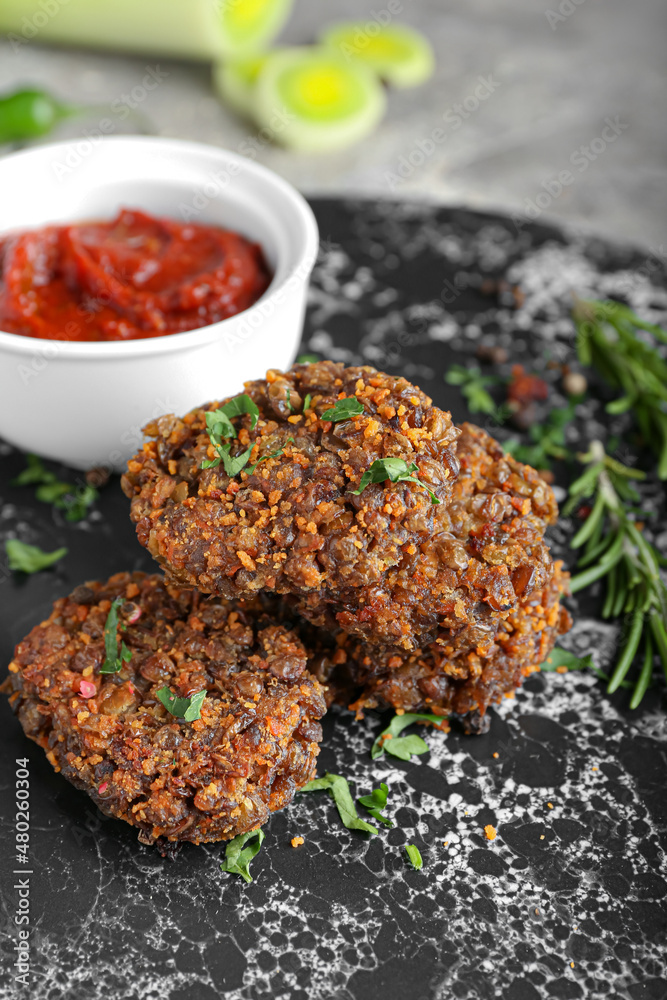 Tasty lentil cutlets on board, closeup