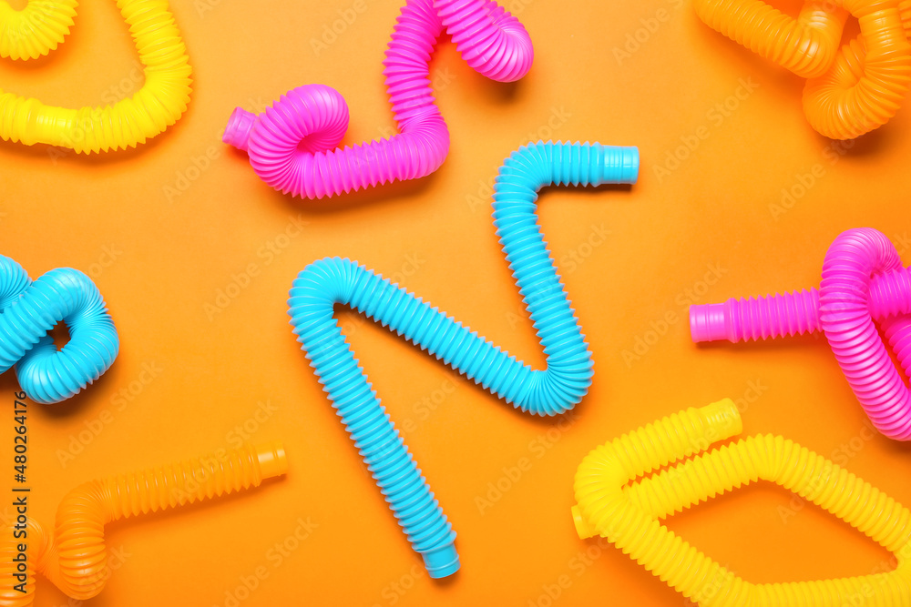 Pop Tubes on orange background