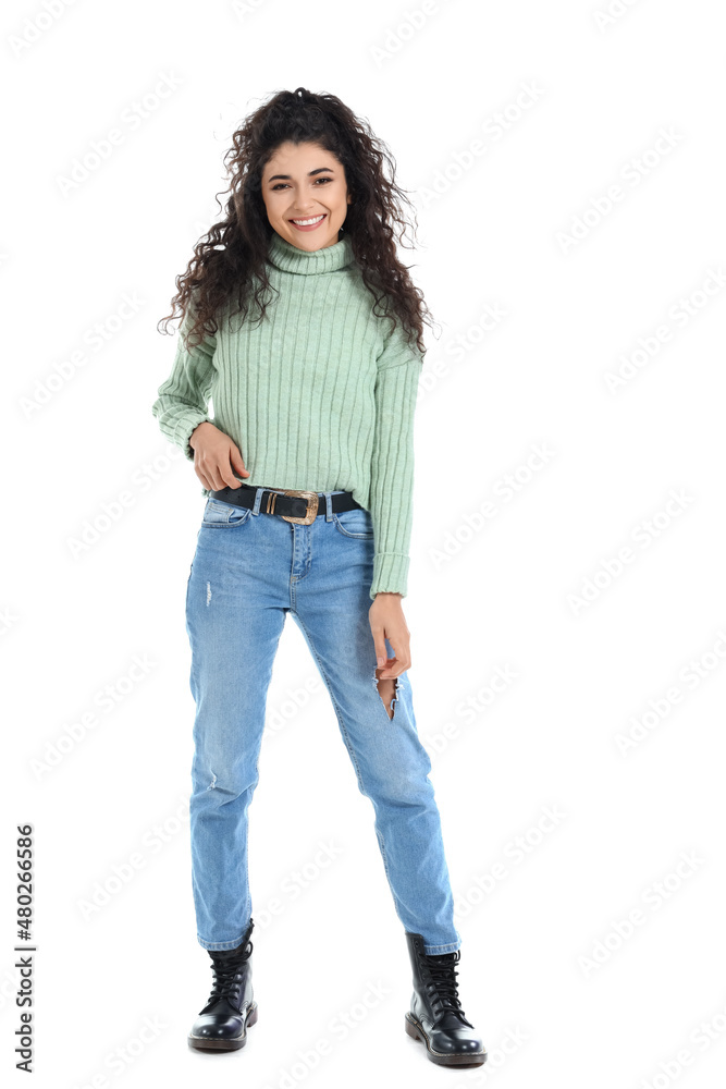 Pretty young woman in warm sweater on white background