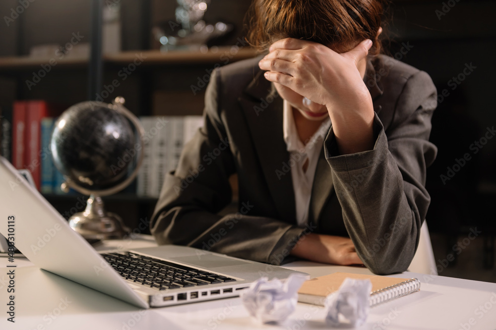 portrait of stressed business woman with social network diagram in the office.