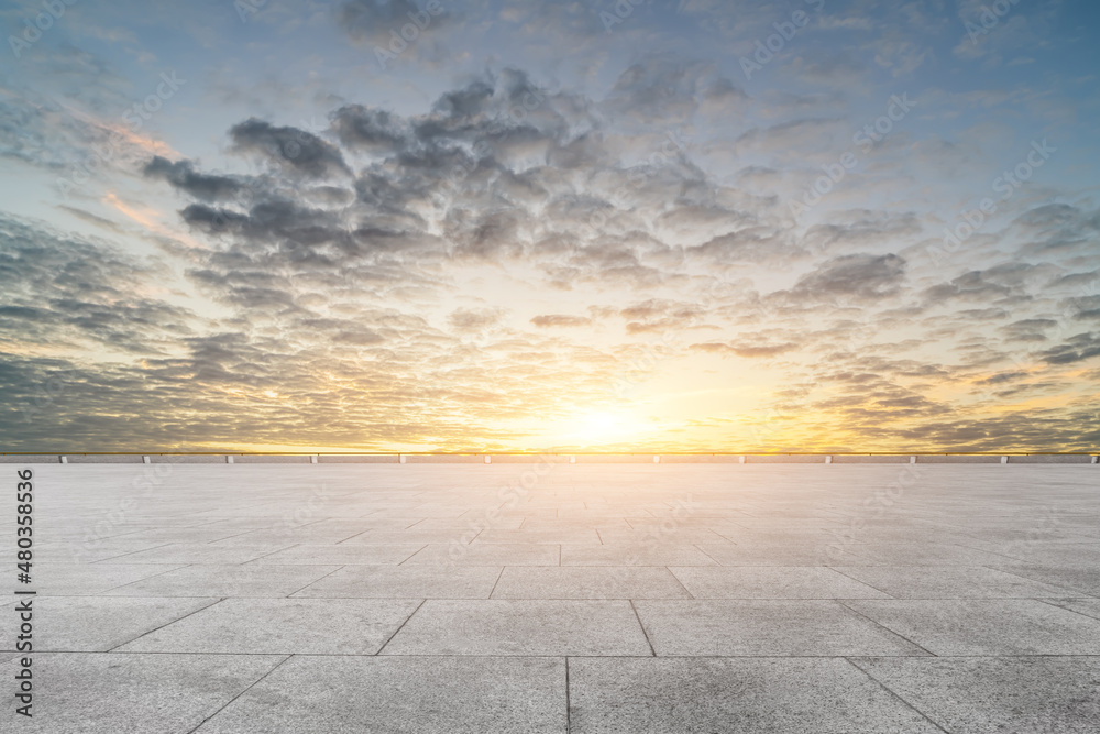 empty tile floor in blue sunny sky