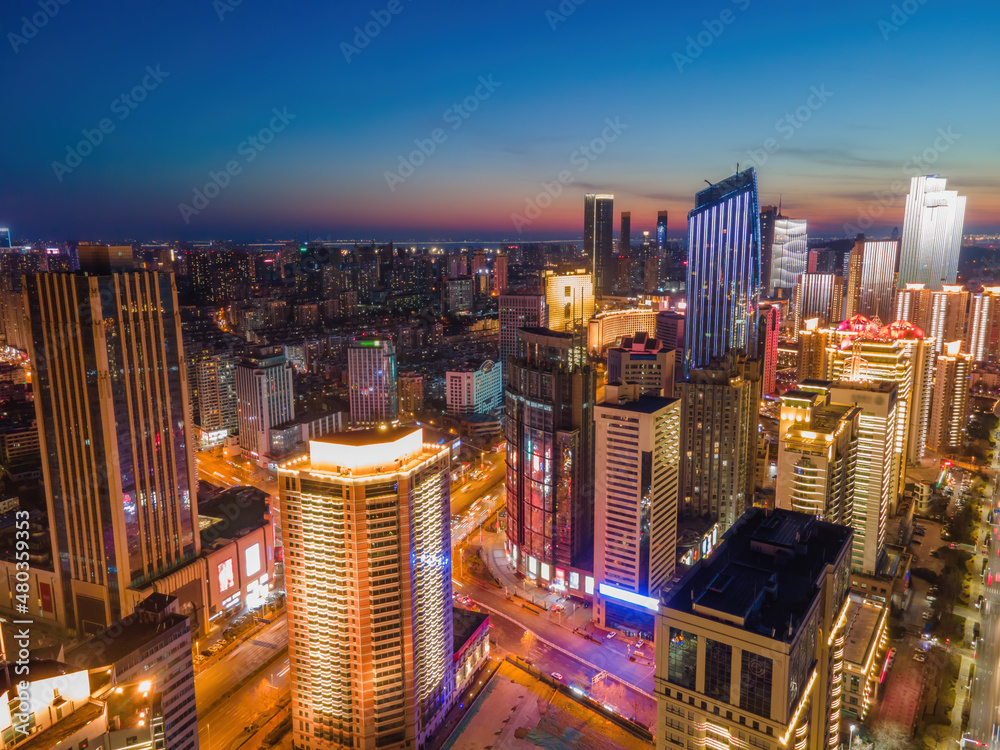 Aerial photography night view of modern city buildings in Qingdao, China