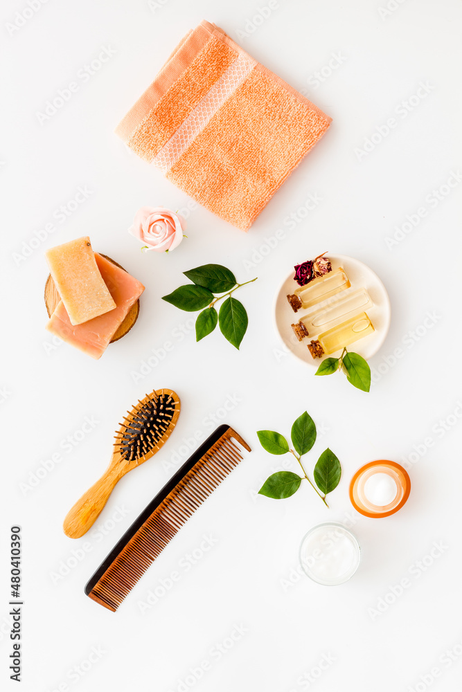 Hair care products with brush flat lay, top view