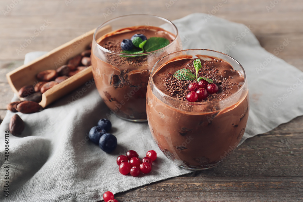 Glasses of sweet cocoa dessert on table