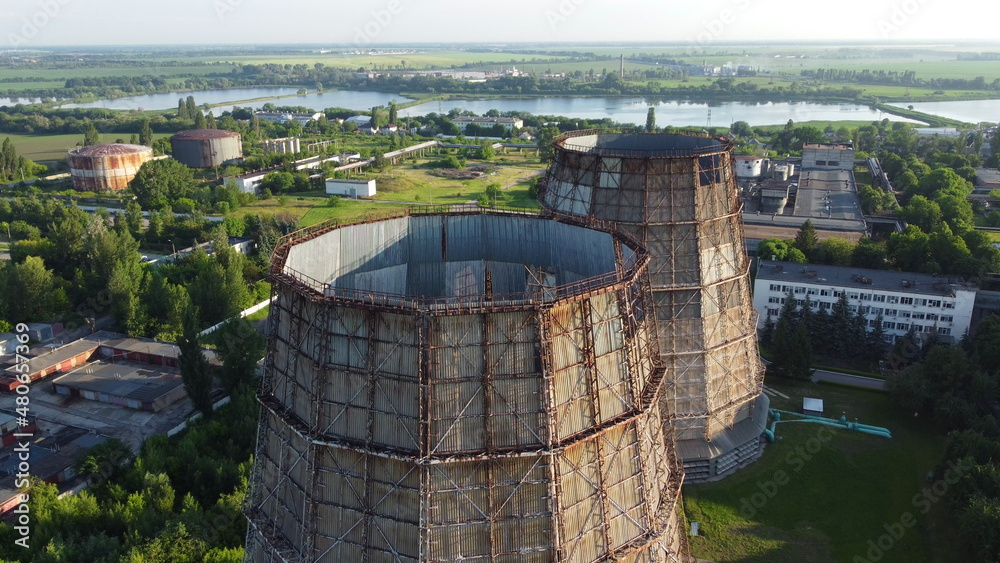 Aerial drone view flight near thermal power plant. Cooling towers of CHP