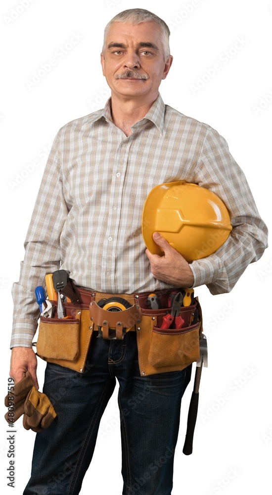 A friendly male worker wearing a hard helmet