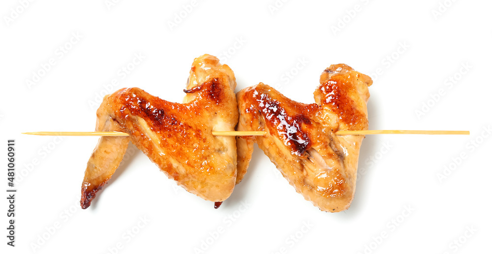 Grilled chicken wings skewer on white background