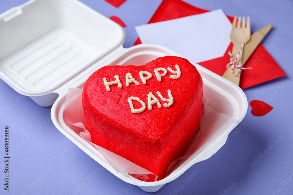 Plastic lunch box with tasty bento cake for Valentines Day on purple background