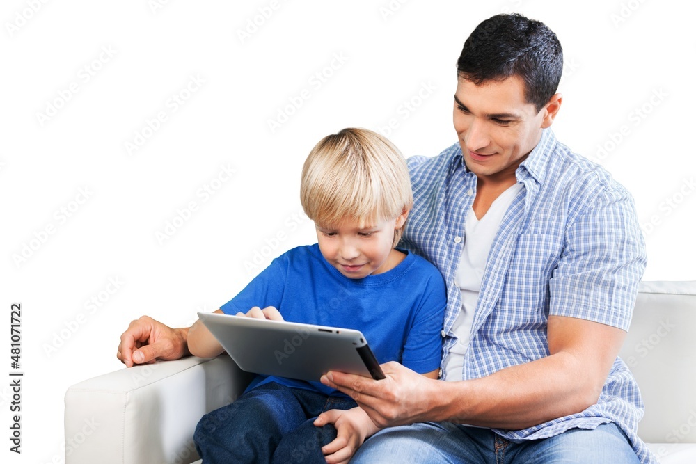 Young father and son using a digital tablet