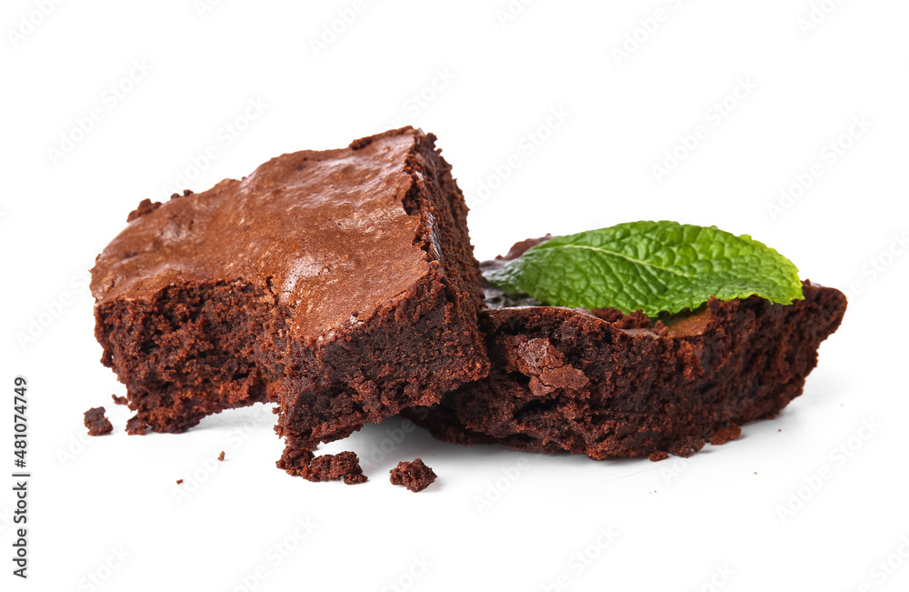 Pieces of tasty chocolate brownie isolated on white background