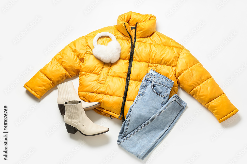 Female jacket, earmuffs, jacket and shoes on white background