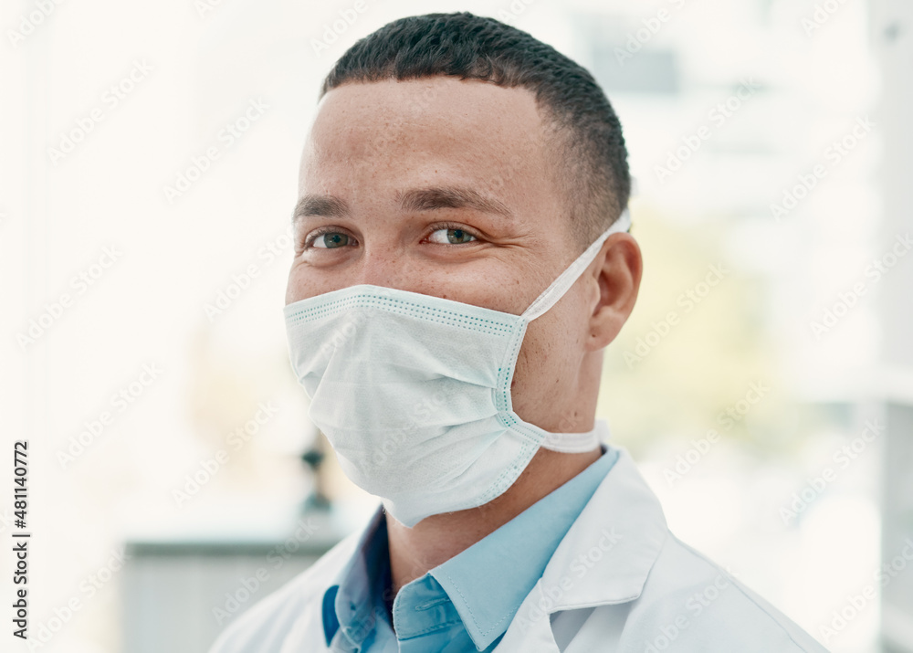 Safety comes first in our lab. Portrait of a confident young scientist wearing a mask in a modern la