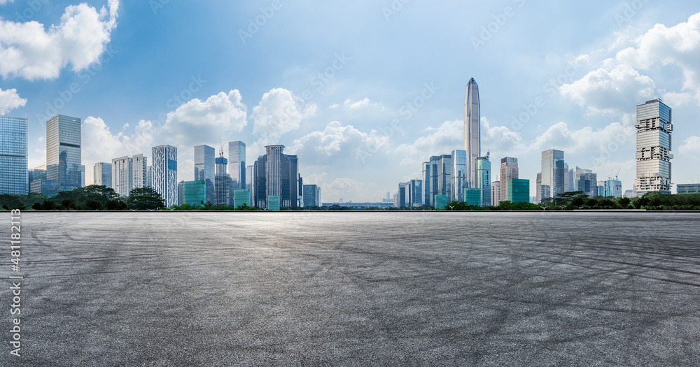 Asphalt road and city skyline with modern commercial office buildings in Shenzhen, China.