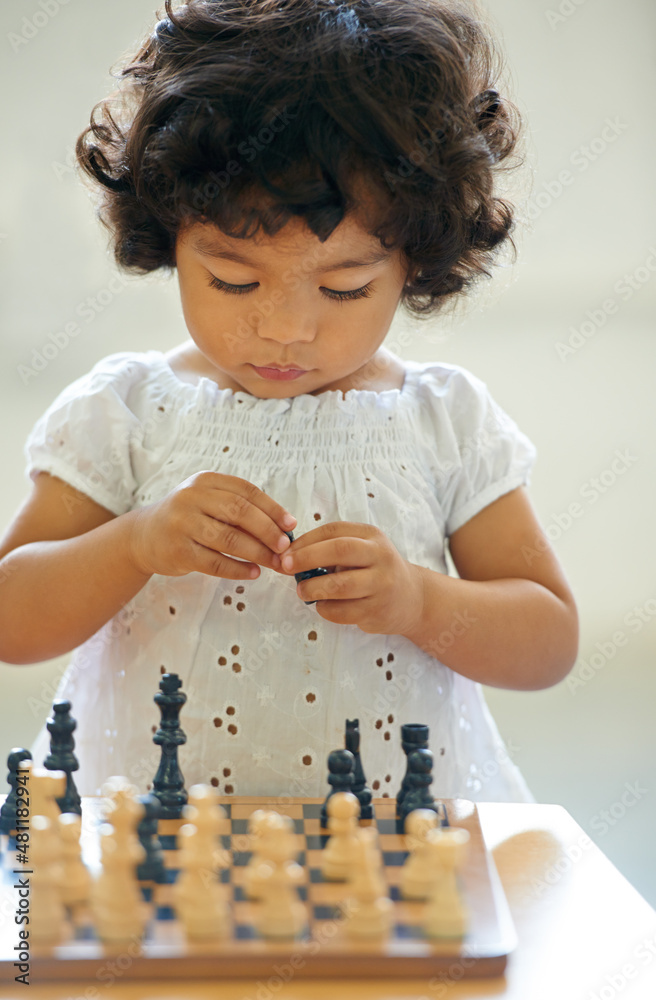 Learning as she grows. Shot of a cute little girl at home.