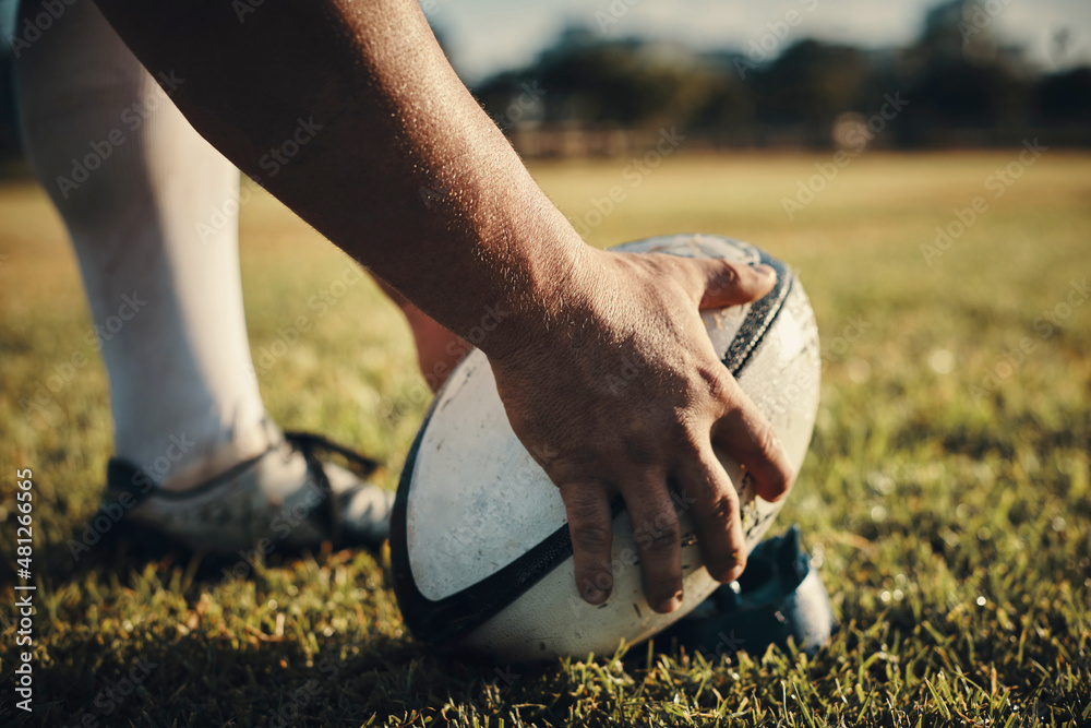 Hes the kick master. Cropped shot of an unrecognizable rugby player preparing for a kick on the fie