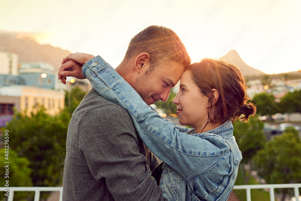 My heart beats for you. Shot of a happy young couple enjoying a romantic moment in the city.