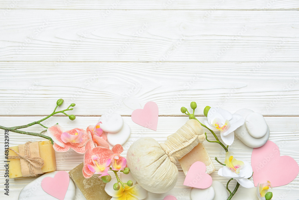 Beautiful spa composition with stones for Valentines Day celebration on light wooden background