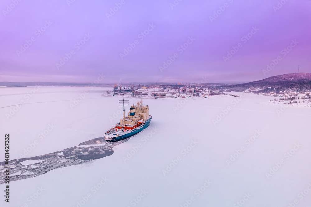 Icebreaking vessel in Arctic with background of sunset