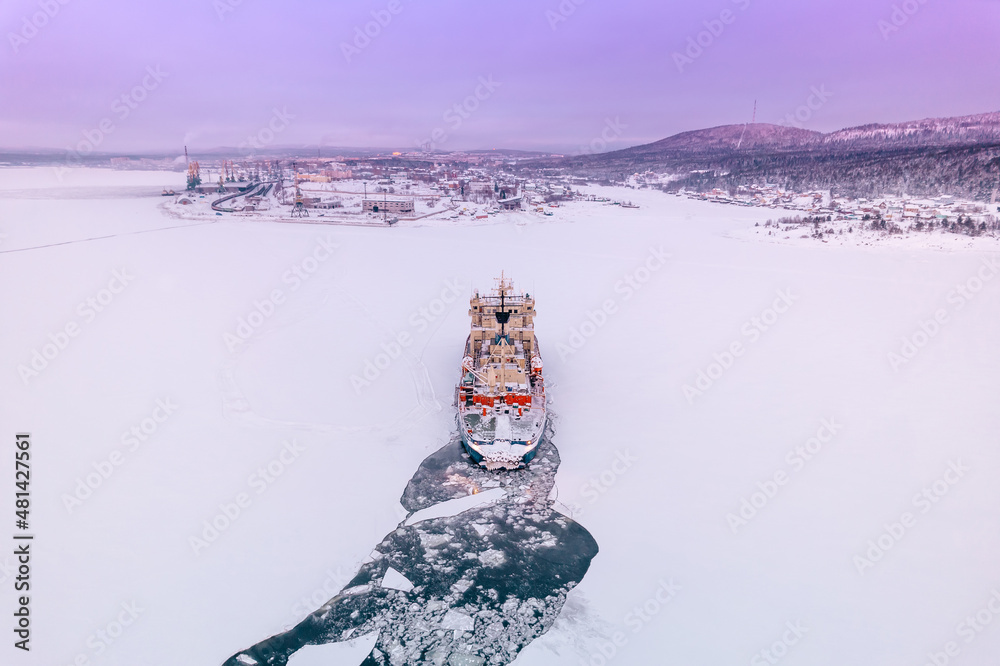 Icebreaking vessel in Arctic with background of sunset