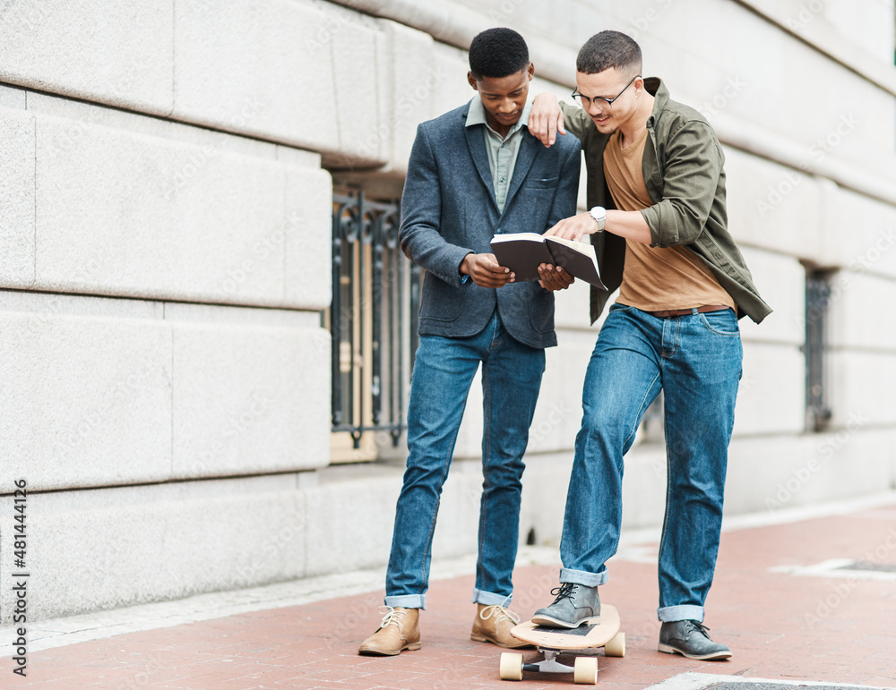 Less desks, more getting it done. Shot of two young businessmen having an informal meeting against a