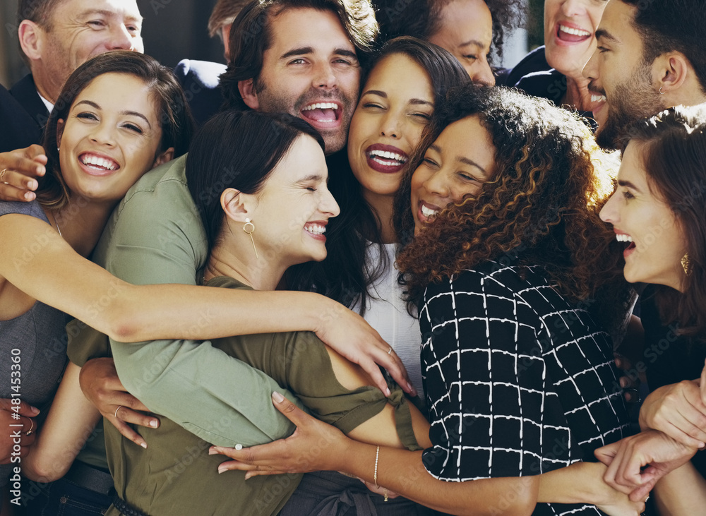 More than colleagues. Cropped shot of a group of happy businesspeople standing in their workplace lo