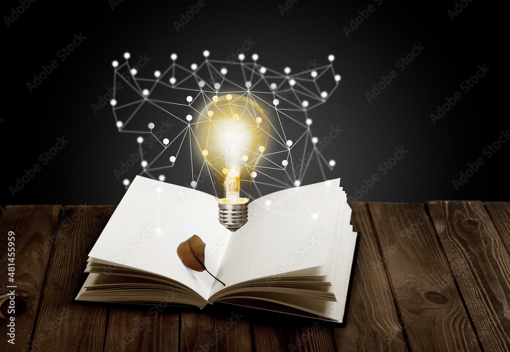 Light bulbs and books. Concept of reading books, knowledge, and new ideas.