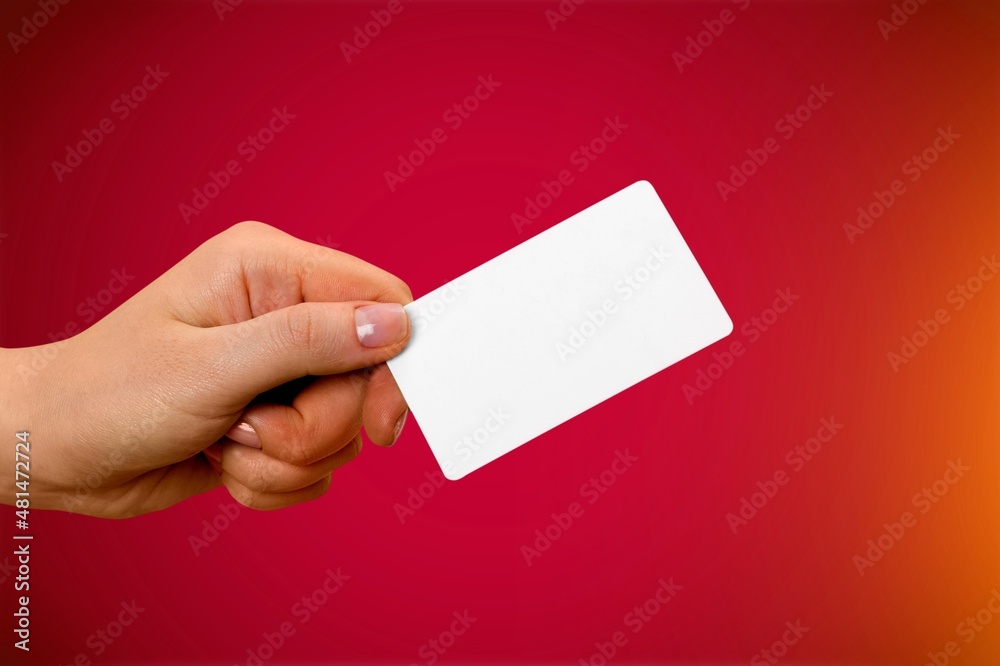 Young female hand and template Bank credit card with online service on background