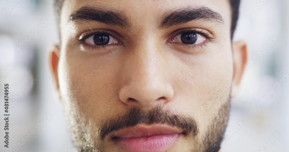 The face of success. Cropped shot of a young handsome businessman in a modern office.