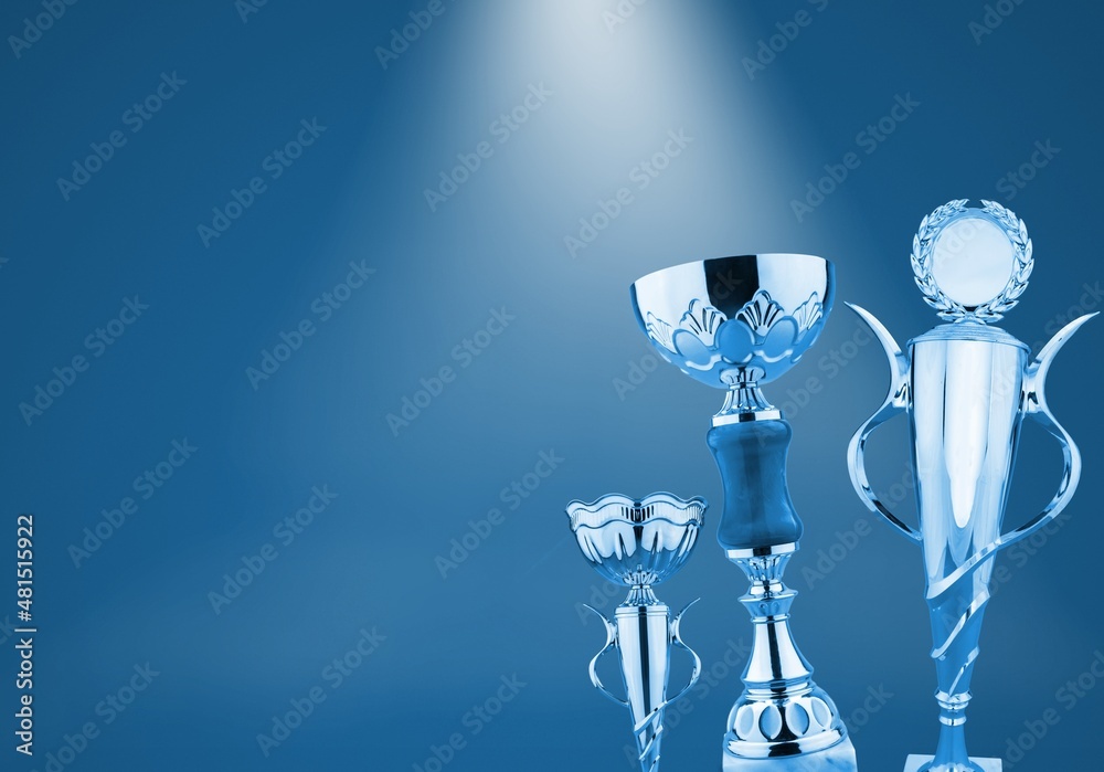 Shiny winning trophy against blue background