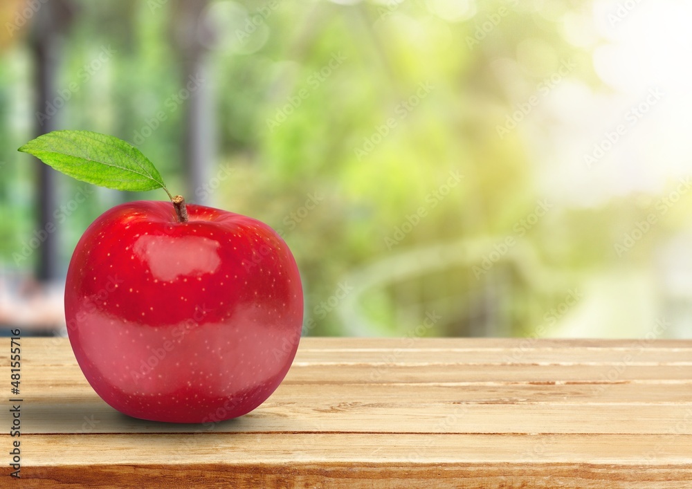 Fresh sweet ripe apple on the desk