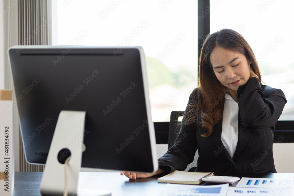 A business woman has a pain in the nape of her neck. Woman with neck pain from hard work doing stret