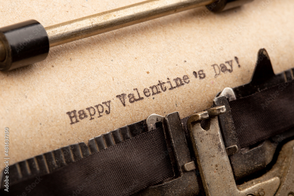 Happy Valentine`s day - phrase on typewriter. Valentines Day greetings concept. Valentines greeting 