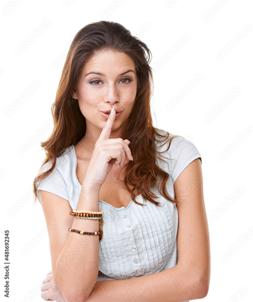 This is our little secret. Portrait of a pretty young woman with her finger to her lips.