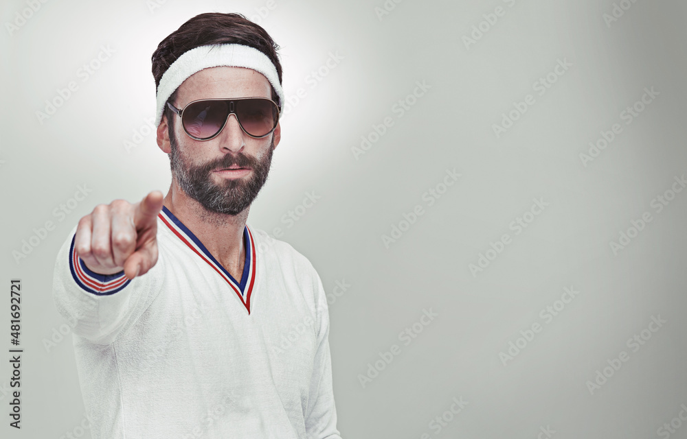 You wanna challenge me. Portrait of a young man pointing at you in the studio.