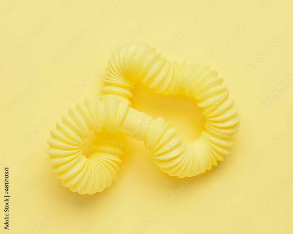 Pop Tube on yellow background