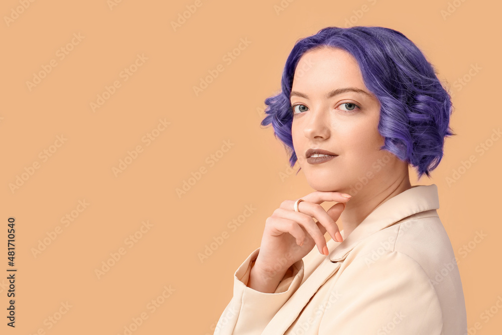 Beautiful young woman with violet hair on color background. Very Peri - color of year 2022