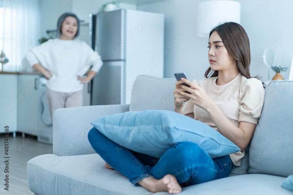 Asian angry senior mature woman shouting at stubborn fussy daughter. 