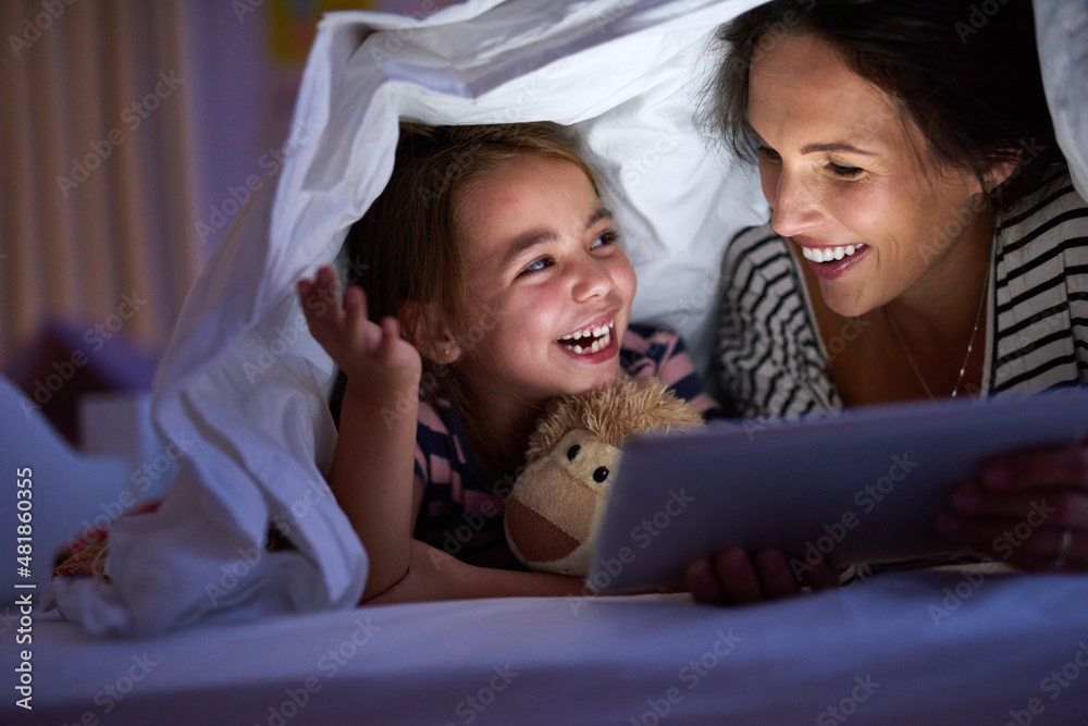 Can we read another one, Mom. Cropped shot of an attractive young woman reading her daughter a bedti