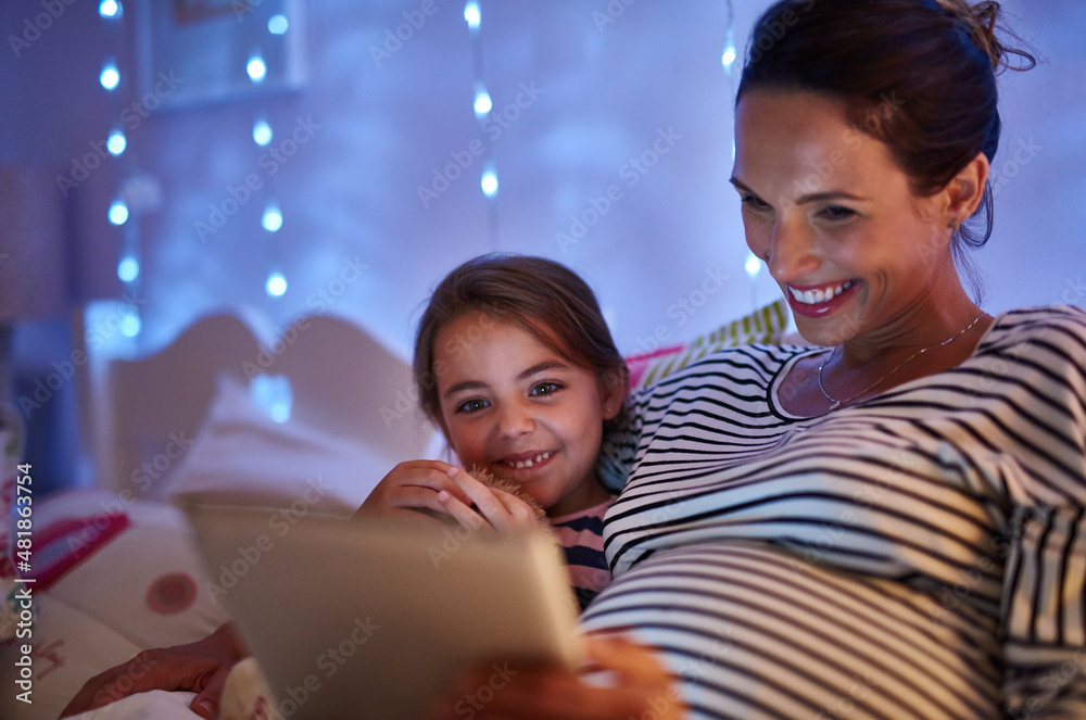 Can we read another one, Mom. Cropped shot of an attractive young woman reading her daughter a bedti