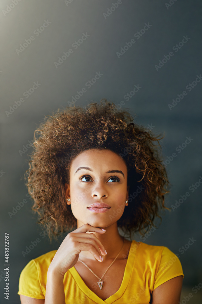 It all starts with one idea. Studio shot of a thoughtful young woman posing against a dark backgroun