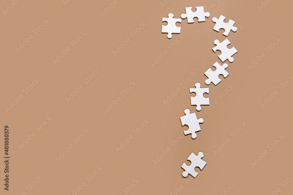 Question mark made of puzzles on color background