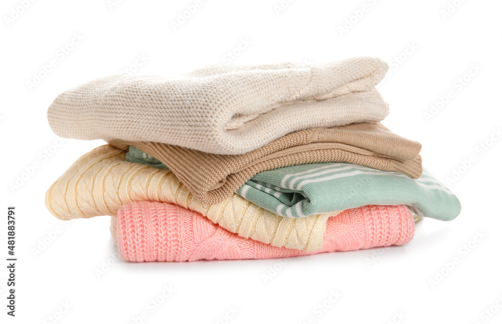 Stylish baby sweaters on white background