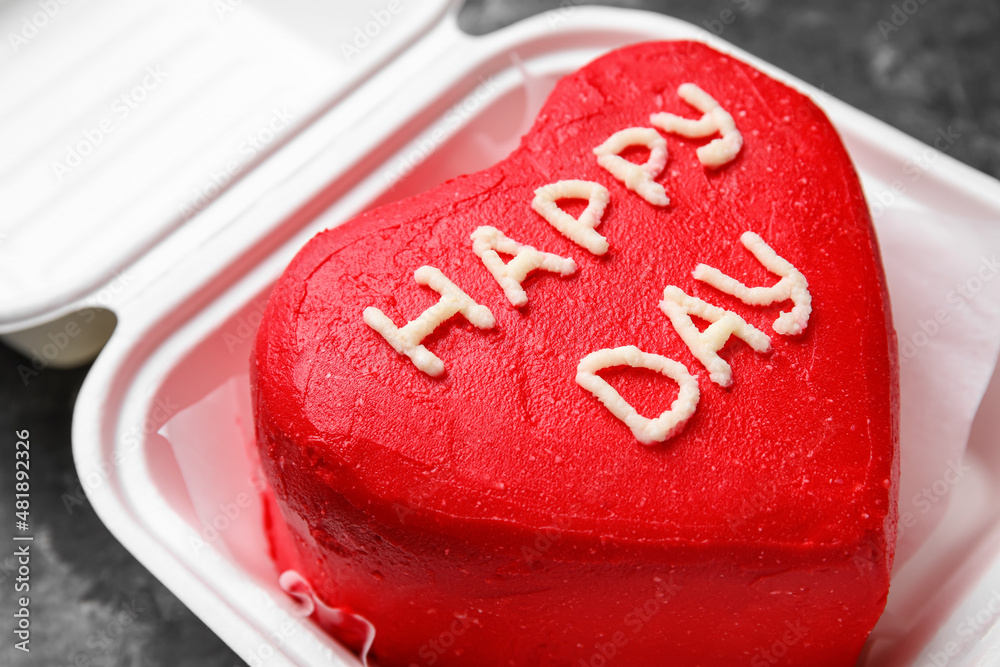 Plastic lunch box with tasty bento cake on grey background, closeup