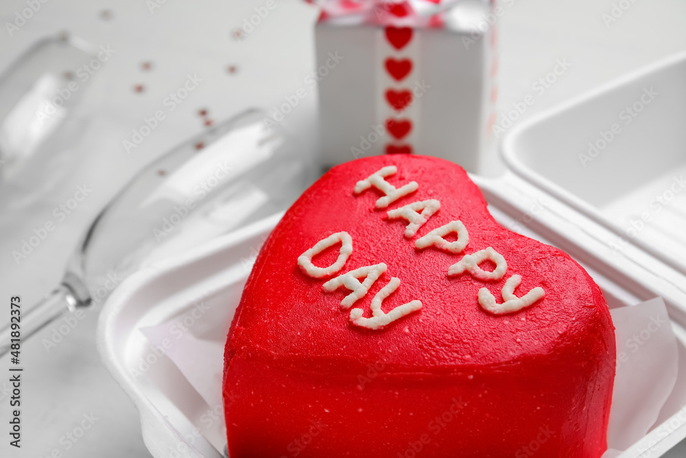 Plastic lunch box with tasty bento cake on light background, closeup